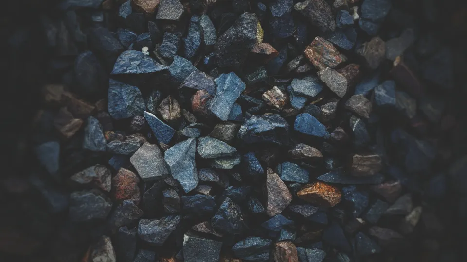 Rock ore sitting in a pi