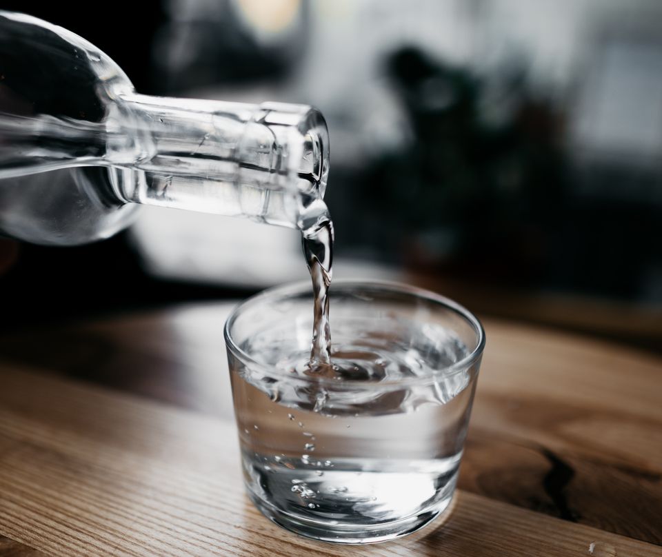 Pouring water into a glass